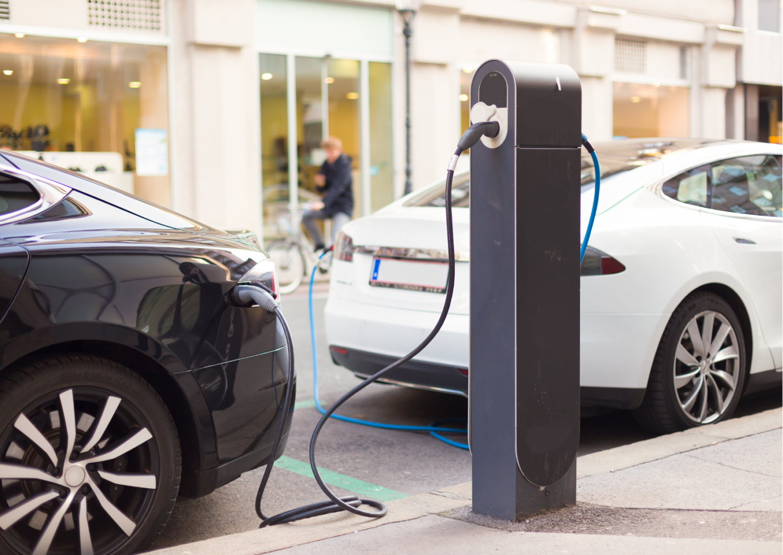 10 Two electric cars charging at a chargepoint