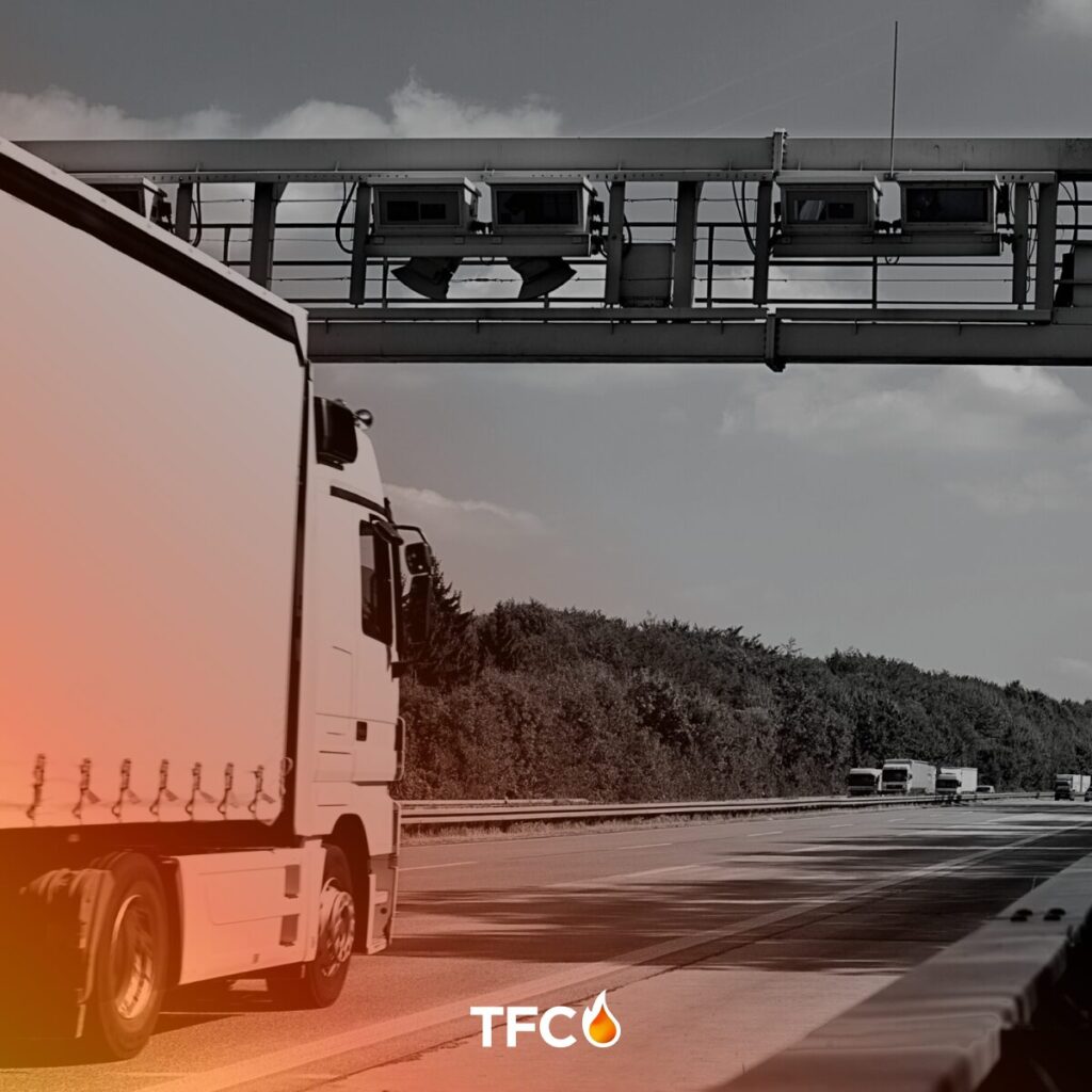Truck under EU toll gantry - 2025 road freight costs and compliance playbook